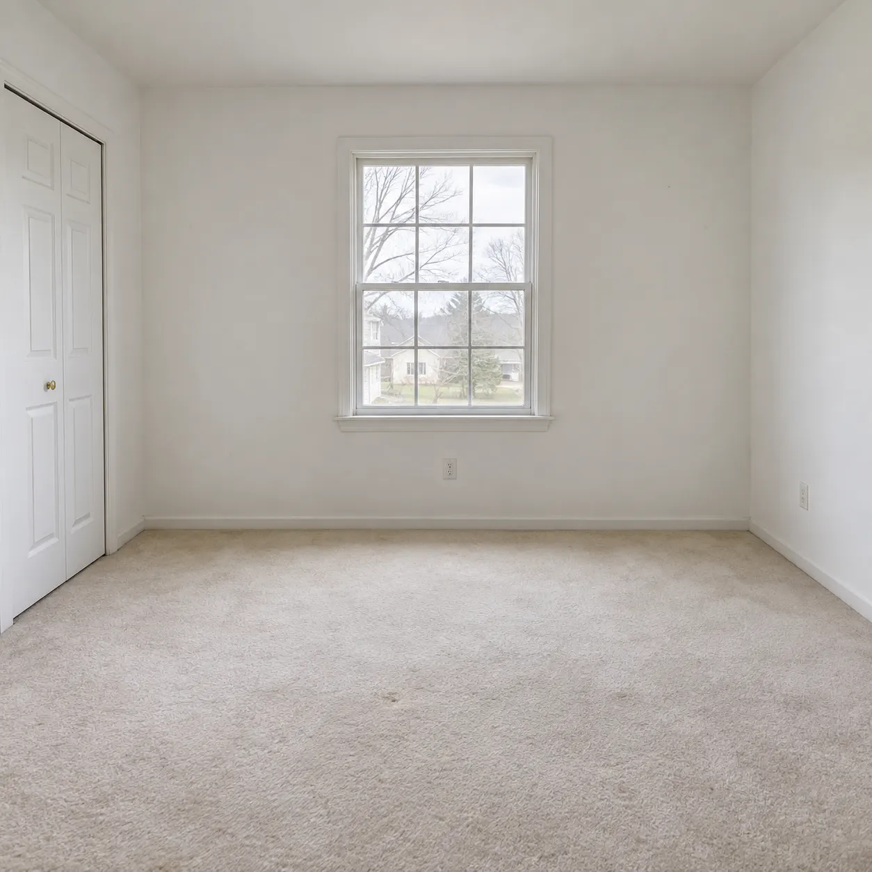 A vacant property room furnished while its architecture remains unchanged — before